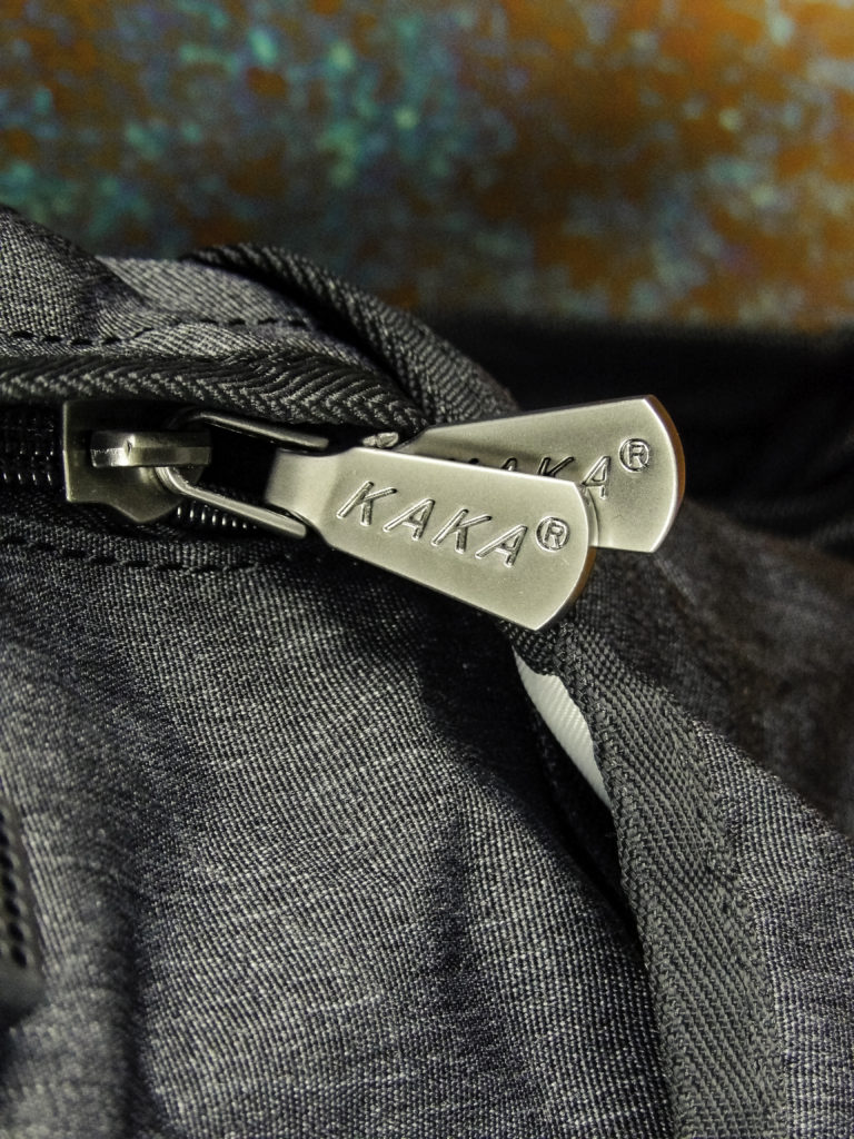 It has stylish silvertone heavy zipper pull accents