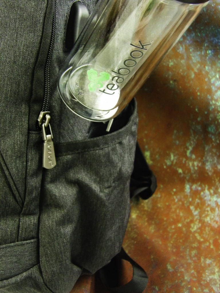 Water bottle pocket holds bottles or a coffee thermos