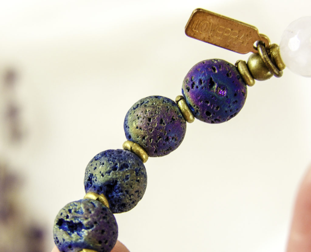 Close up of LovePray lava beads. The porous beads hold essential oils all day long