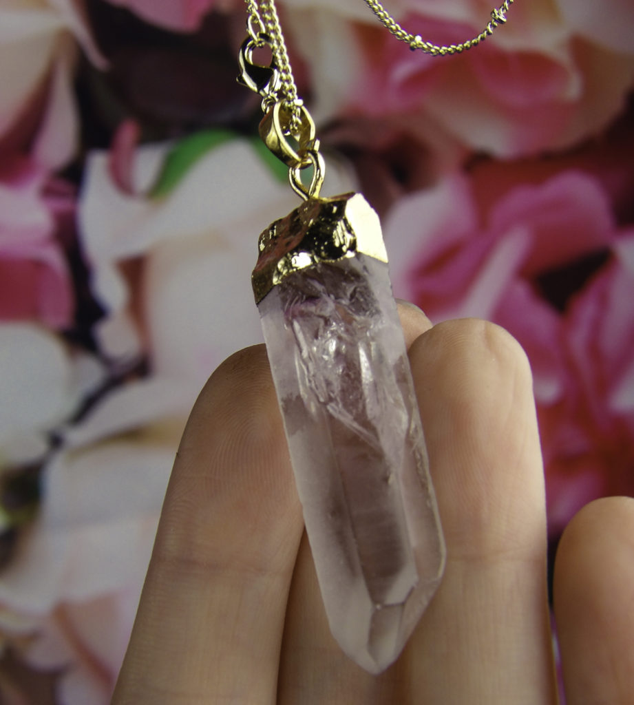 Gold dipped copper construction securely holds the raw quartz crystal