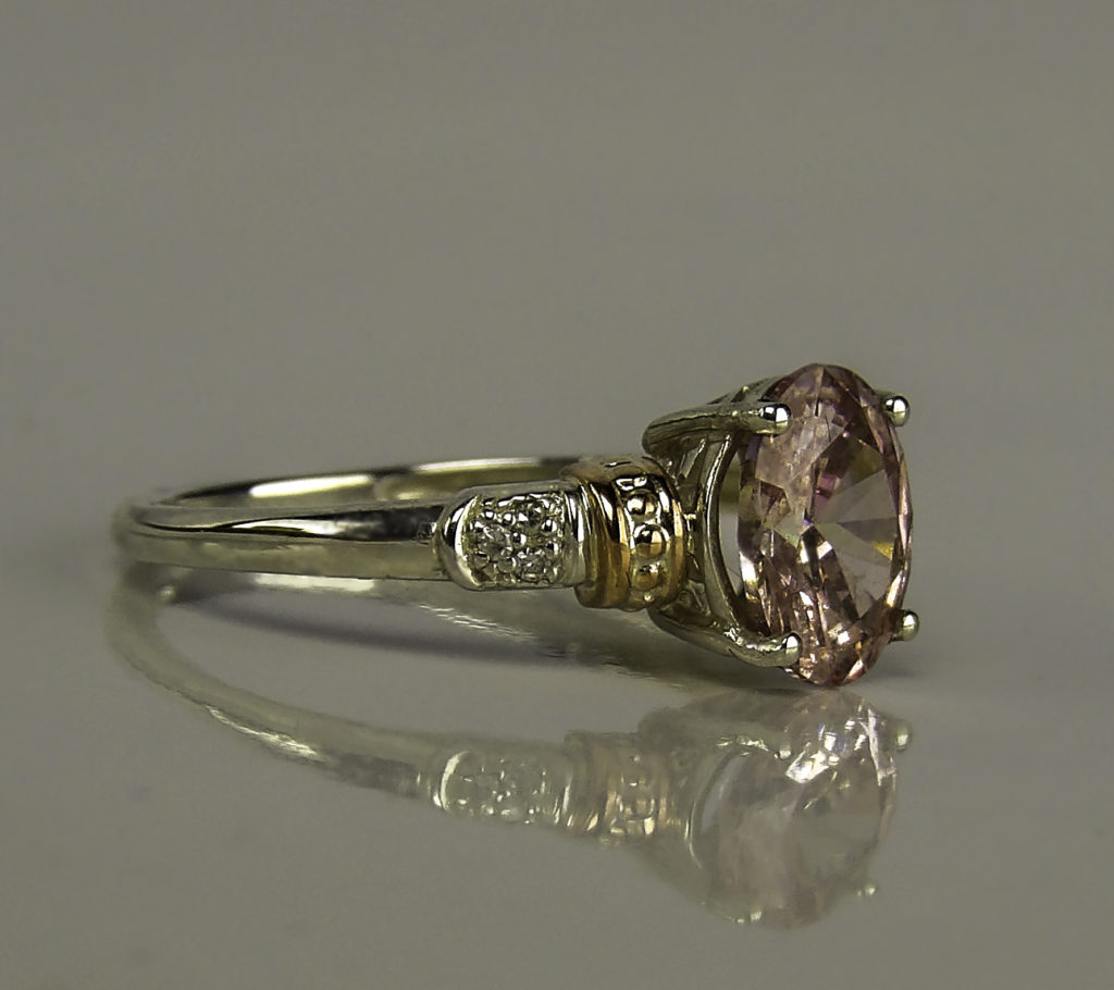 The center stone is in a classic four prong setting