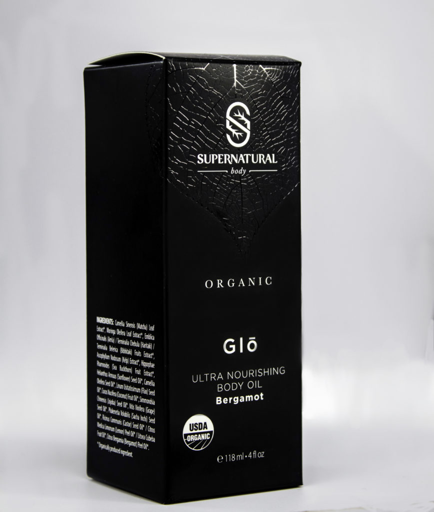 Supernatural Body Glo Body Oil comes in a sleek embossed pattern box
