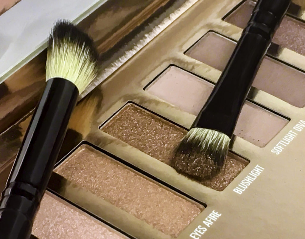 LuxLight Palette and Essential Brush Set. Brush is loaded with Brushlight, a shimmering copper shade
