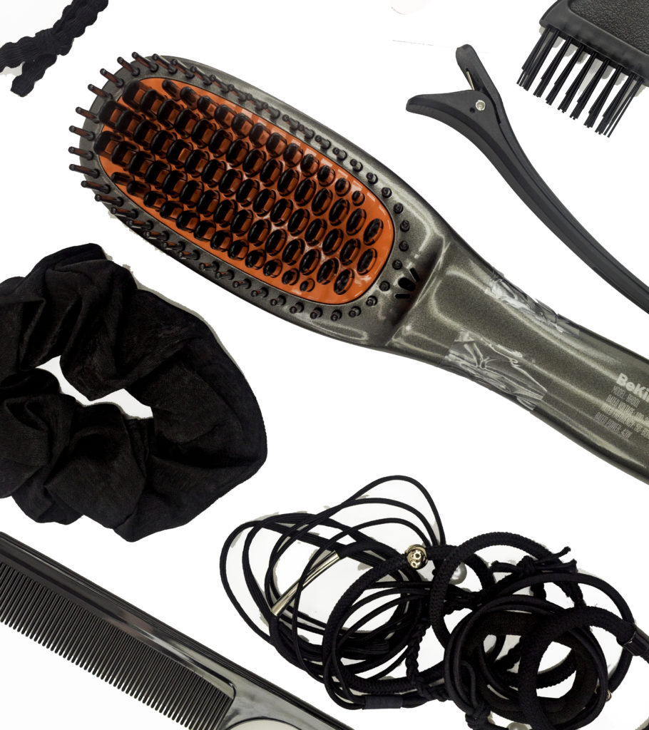 The brush comes with several styling tools and hair accessories