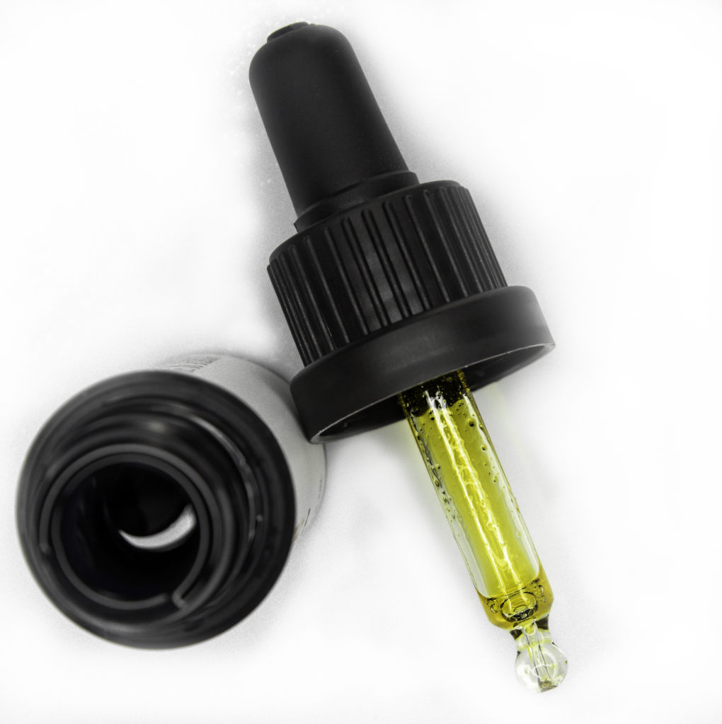 Silky, golden oil dispenses one drop at a time from this bubble dropper